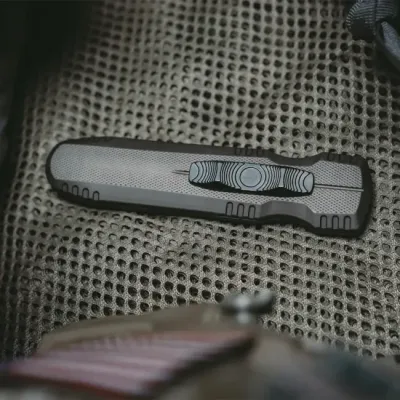 Розкладний ніж SOG Pentagon OTF, Flat Dark Earth (SOG 15-61-02-57) - 8 - Robinzon.ua
